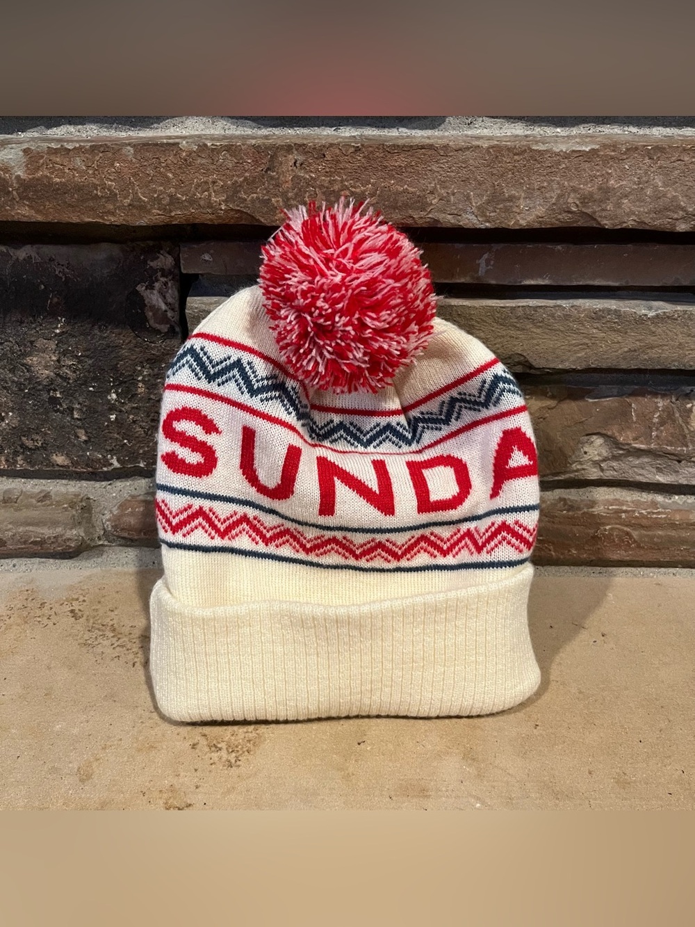 Sundance Ski Resort Cream and Red Pom Pom Beanie from Spacecraft Collective